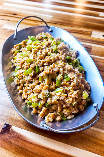 A vibrant plate of 4-ingredient vegan Chicky sisig, a plant-based twist on the classic Filipino dish, featuring Missus Chicky, onion, green bell pepper, and vegan mayo, garnished with calamansi for an authentic flavor. Perfect with rice or beer.